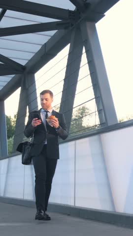 Business man goes to work in the morning. Vertical video