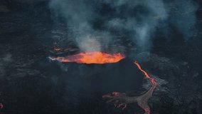 Flowing lava, hot magma spilling out of the volcano crater, aerial side view. Concepts of volcanic eruption and Icelandic land of fire and ice. - Powered by Shutterstock - Get 15% off with code: PIKWIZARD15