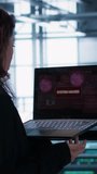 Vertical video Cybersecurity expert in data center frantically trying to counter a hacker attack. Server room worker under pressure to secure sensitive information after threat alert received on - Powered by Shutterstock - Get 15% off with code: PIKWIZARD15