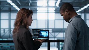 Software developers in data center use AI technology on tablet to optimize storage volumes. IT specialists in server hub facility using artificial intelligence to ensure seamless operations, camera A - Powered by Shutterstock - Get 15% off with code: PIKWIZARD15