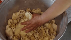 Crafting traditional Mexican tamales with masa, filling, and corn husks - Powered by Shutterstock - Get 15% off with code: PIKWIZARD15