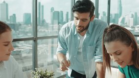 Skilled marketing team putting hand together with document scatter around at business meeting room with cityscape view. Businesspeople celebrate success. Represented cooperation, unity. Tracery - Powered by Shutterstock - Get 15% off with code: PIKWIZARD15