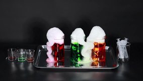 Colorful foam erupts from beakers with dry ice - Powered by Shutterstock - Get 15% off with code: PIKWIZARD15