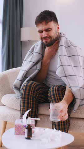 Medicine, taking pill. Sick man is feeling bad at home.