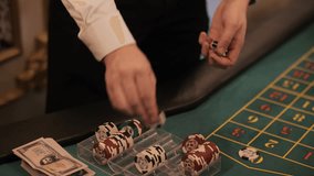 Casino dealer placing bets on roulette table - Powered by Shutterstock - Get 15% off with code: PIKWIZARD15