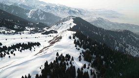 Kok Zhailau tract. Mountainous area with coniferous trees. Winter. The view from the drone. - Powered by Shutterstock - Get 15% off with code: PIKWIZARD15