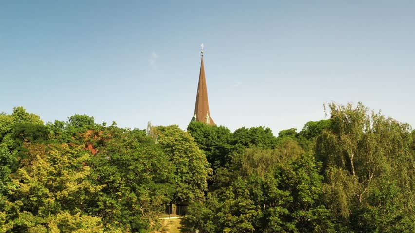 Drone ascending in distance to Tower of St. Joseph