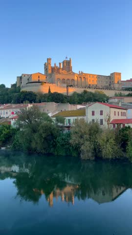 The Orb river with the Cathedral of Saint Nazaire in Beziers, Southern France. 