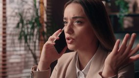 Serious thoughtful doubtful Caucasian businesswoman female girl lady business woman worker boss talking mobile phone call gesturing unsure displeased smartphone conversation discussing work in office - Powered by Shutterstock - Get 15% off with code: PIKWIZARD15