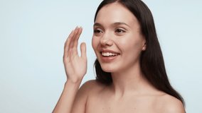 A young female gently applying lip balm on her lips, a daily beauty routine for lip care and hygiene. - Powered by Shutterstock - Get 15% off with code: PIKWIZARD15