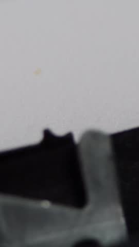 Portrait vertical footage of an old fashioned vintage typewriter spelling out the word Love, old fashioned love letter or romance story concept