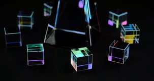 Crystal cube and pyramid prism with refraction and holographic effect on dark background - Powered by Shutterstock - Get 15% off with code: PIKWIZARD15