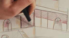 Young man artist is drawing buildings by colour pencil on white paper top view. The architect making sketches for the projection of the building. Drawing and sketching lessons - Powered by Shutterstock - Get 15% off with code: PIKWIZARD15