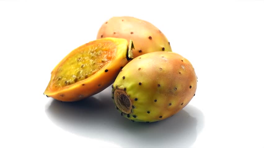 Prickly pear cactus, Opuntia edible fruit macro shot. Fresh tasty sweet exotic fruits. Opuntia ficus indica isolated on white background, rotating. 