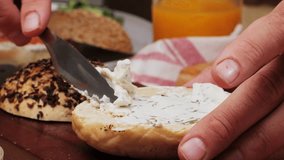 Bagel sandwich brunch, lunch plate of a bagel with smoked salmon and cream cheese and ham, close up morning cafe menu. - Powered by Shutterstock - Get 15% off with code: PIKWIZARD15