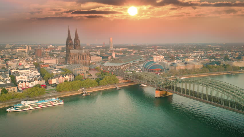 Cologne Aerial skyline view drona footage fly over cologne river and bridge in front old town and cologne cathedral dome at susnet.