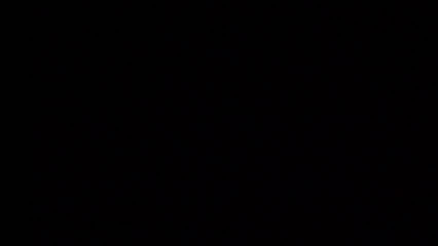 Gas oven flaming in the dark, closeup. Top View