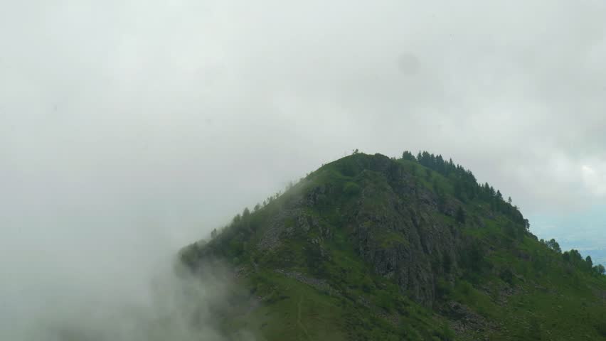Beautiful amazing Fog over Mountain peak. High quality 4k footage