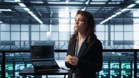 Technicians in high tech AI data center workspace looking at hologram visualization. Programmer working on securing server room hardware using AR artificial intelligence tech, camera B - Powered by Shutterstock - Get 15% off with code: PIKWIZARD15