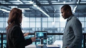 Team of engineers in data center with tablet integrating AI driven automation tools, doing maintenance. Teamworking colleagues in server room using artificial intelligence, camera B - Powered by Shutterstock - Get 15% off with code: PIKWIZARD15