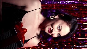 Vertical video. Holiday gift. Christmas party. Celebration night. Festive surprise. Excited woman elegant dress with present box in hands on red shimmering cascade curtain background. - Powered by Shutterstock - Get 15% off with code: PIKWIZARD15