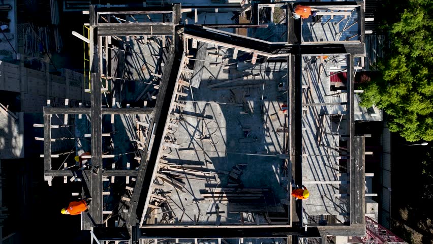 Aerial Video Construction Site Timelapse with Cranes, Trucks, and Workers Building Structures A vibrant scene of progress in motion.
