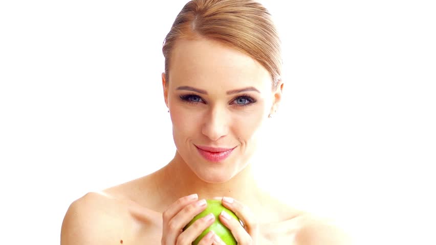 Happy Blond Woman Holding Green Apple While Isolated on White Background

