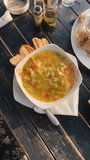 Alfresco dining vertical video. Camera pans over table of food, top down shot, sunlight cast on table during sunset outdoors. Travel dining concept. Authentic local food of Cuba. - Powered by Shutterstock - Get 15% off with code: PIKWIZARD15