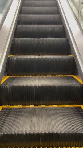stairs escalator going up close-up steps