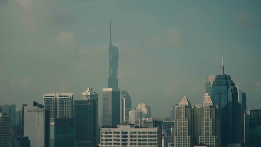Static shot of skyline of Kuala Lumpur city featuring Warisan Merdeka tower in Malaysia.