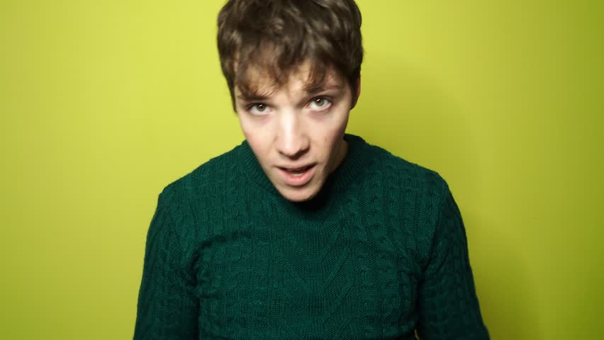 Happy young attractive student rejoices.