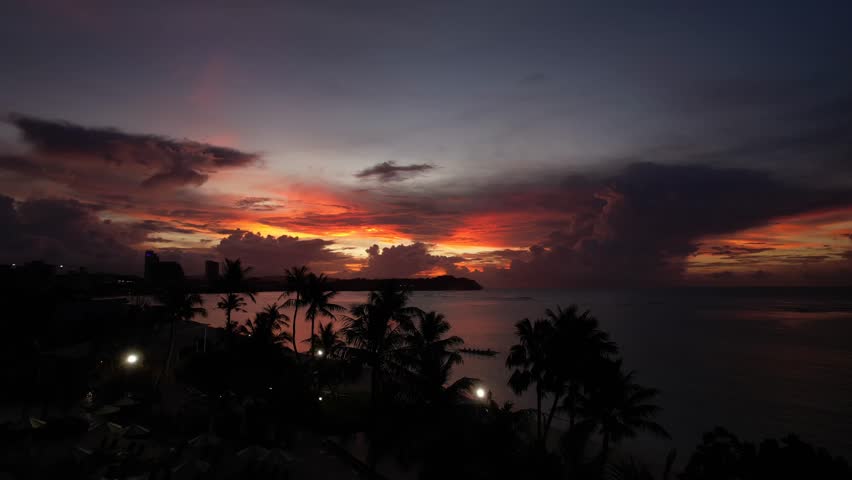 Drone Flys Over Palm Trees Over Ocean Toward Sunset, Guam