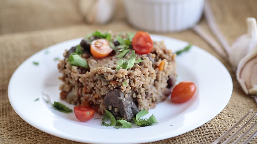 cooked bulgur with mushrooms and vegetables.