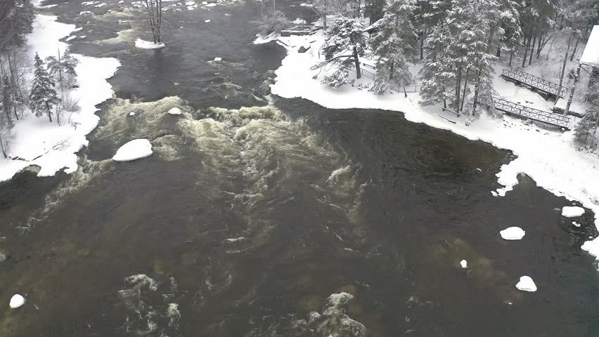 Enjoy aerial views of the Kotka region in Finland, showcasing the stunning Baltic Sea river and surrounding winter landscape. Ice and snow highlight the serene beauty of this unique area.	