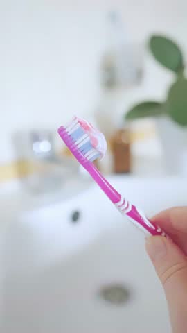 Toothpaste on a toothbrush contains natural salt, helps remove plaque, and strengthens gums. Free from fluoride and artificial additives.