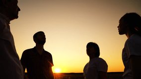 Business people. People united by common idea. Group people raise hands sky, join palms together close-up. Team spirit, holds hands. People connect palms hands close-up against sky. Concept teamwork - Powered by Shutterstock - Get 15% off with code: PIKWIZARD15