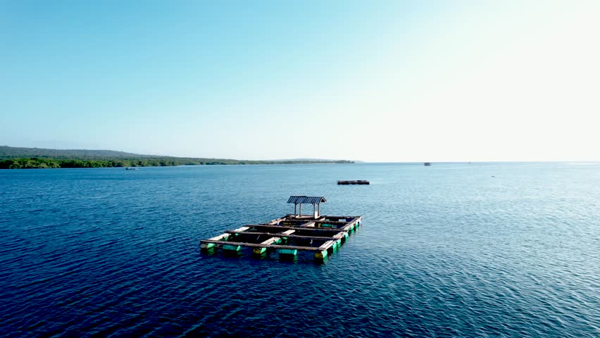 Aerial Floating lobster farms near coastline of Buleleng, North Bali. float fishing village