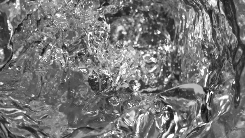 Super Slow Motion Shot of Water Whirling in Glass Bottle at 1000fps.