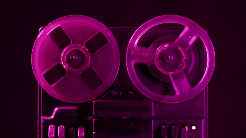 Tape audio music player, studio magnetic tape, vintage retro spool reel to reel player and recorder, magnetic tape data storage close up, music studio. 