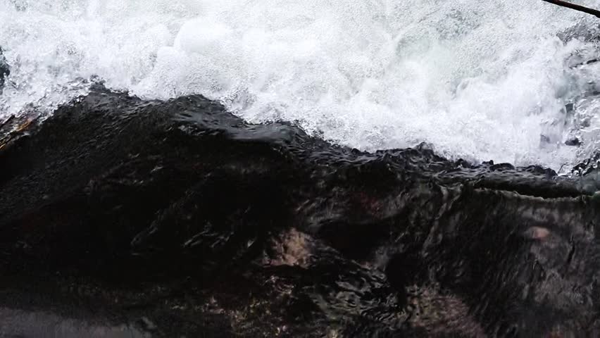 Flow of turbulent, clean, transparent river in place difference in altitude, huge number of air bubbles, concentration of oxygen in water increases, favorable conditions for aquatic living forms