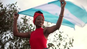 Young garifuna woman proudly displaying honduran flag - Powered by Shutterstock - Get 15% off with code: PIKWIZARD15