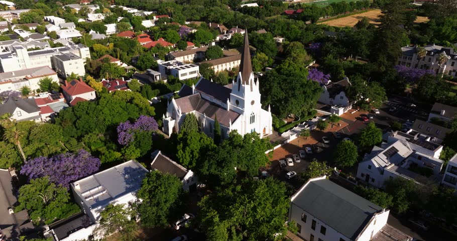 Establishing Drone Shot Above Small Picturesque Church with Steeple. Summer.