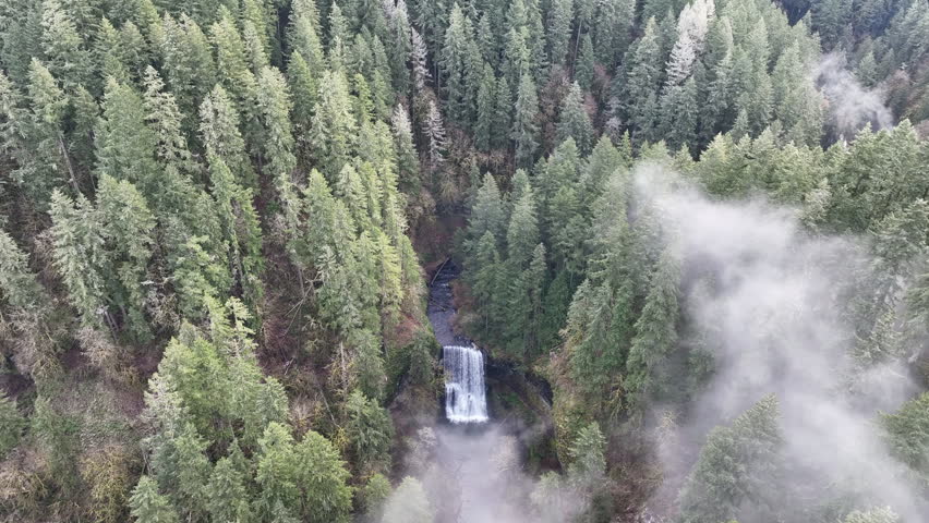 Mist drifts above the beautiful Lower South Falls in Oregon. The entire Pacific Northwest is known for its spectacular outdoor scenery, including mountains, rivers, waterfalls, and coastline.