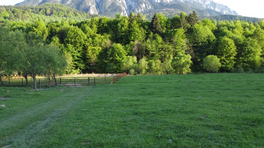 A stunning drone view of Piatra Craiului Mountains, Romania, showcasing rugged peaks and breathtaking landscapes. The aerial perspective captures the beauty of this iconic mountain range, a paradise f