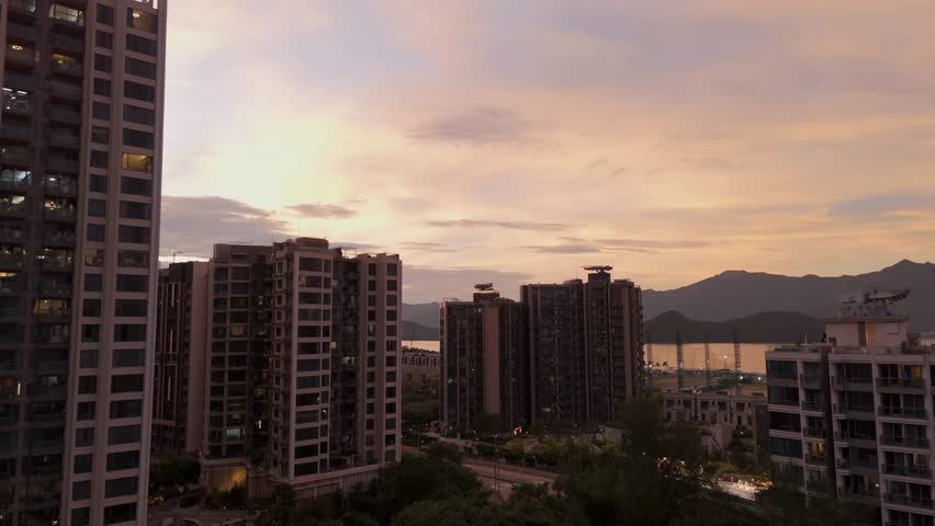Drone shot of buildings in Ma On Shan region in Hong Kong at sunset