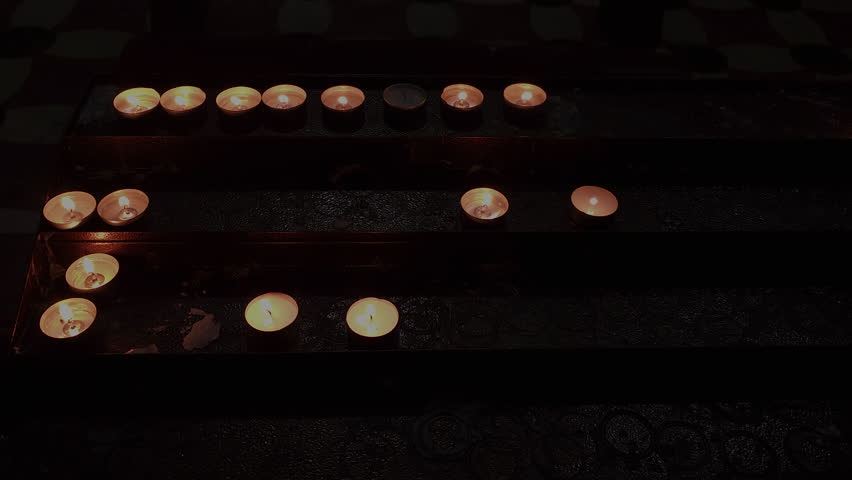 Prayer candles burn in Messina Cathedral