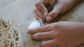 Painting in egg, Easter eggs decoration ,boy painting in a egg for Easter celebration - Powered by Shutterstock - Get 15% off with code: PIKWIZARD15