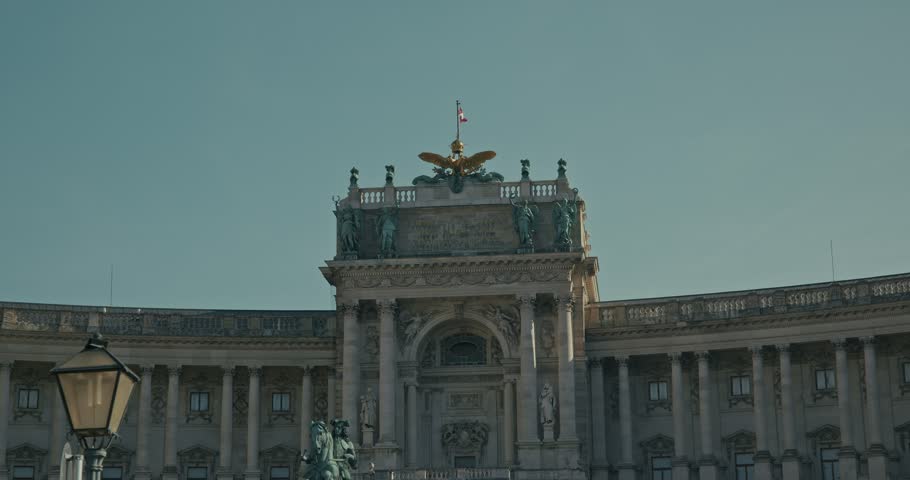 Ornate Hofburg Palace facade under clear sky in Vienna, Austria