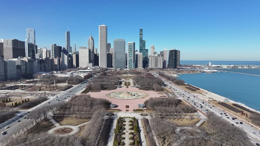 Chicago Skyline At Chicago Illinois United States. Aerial View Of A City Park Surrounded By Busy Streets And Buildings. Business Sky Clouds Downtown Cityscape. Business Downtown Famous.