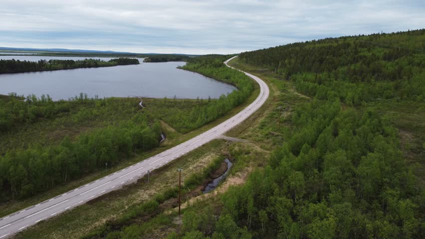 aerial above scenic narrowed road path In Sweden countryside